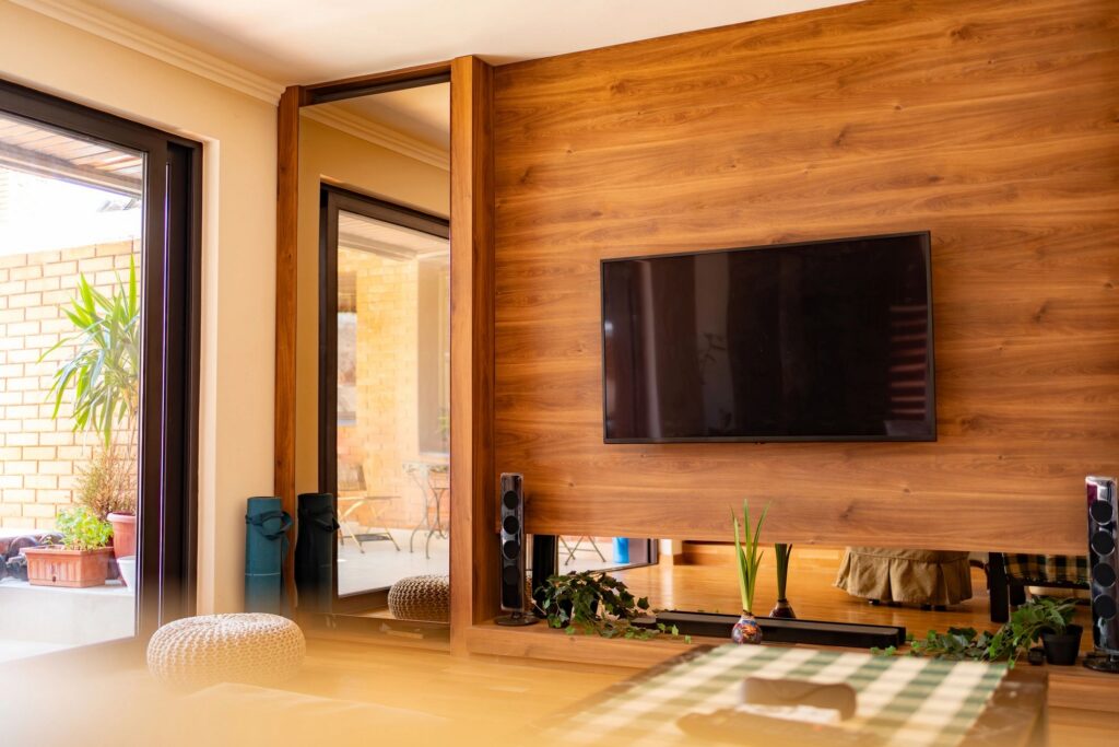 Modern living room interior with tv and wooden paneling